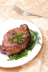 delicious fried steak with herbs