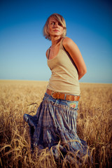 Image of young woman on wheat field