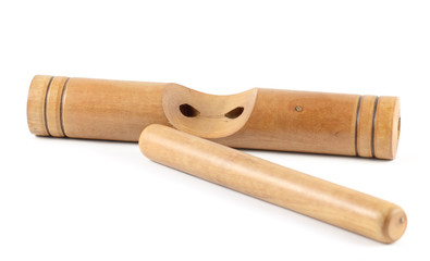 Wooden claves isolated on a white background.