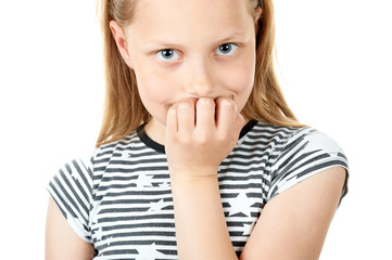 Portrait of a cute pensive little girl on white