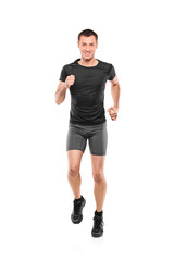 Full length portrait of a male athlete running