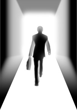 Businessman walking to the light