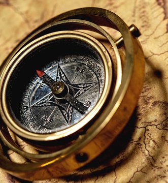 Vintage compass on the old map