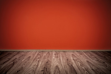 red wall and wooden floor interior design