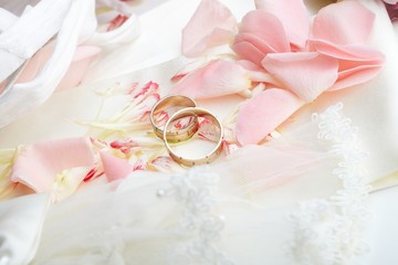 golden rings and rose petals