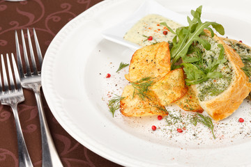 fish pie with sauce and potato chips