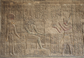 Fototapeta na wymiar Hieroglyphic carvings on an Egyptian temple wall