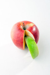 Combination of red apple with green apple slice
