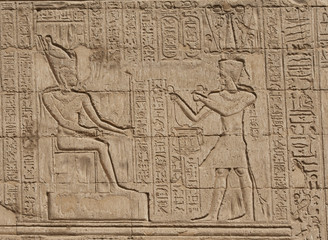 Hieroglyphic carvings on an Egyptian temple wall