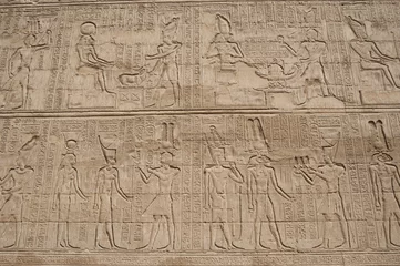Fotobehang Hieroglyphic carvings on an Egyptian temple wall © Paul Vinten
