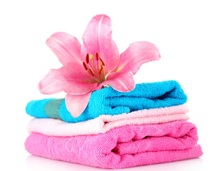 Obraz na płótnie Canvas stacked colorful towels on a white background