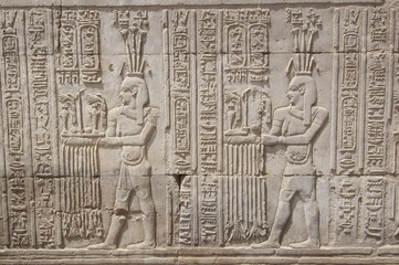 Hieroglyphic carvings on an Egyptian temple wall