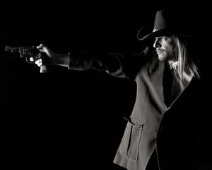 Man in Cowboy Hat Aiming pistol.