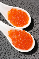 Salmon caviar in spoons