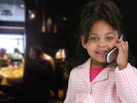 Child on Cellphone in Restaurant