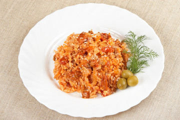 Risotto with meat, mushrooms and tomato sauce