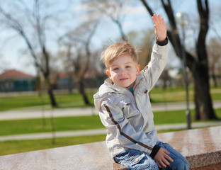 Fototapeta premium young boy walks in the park