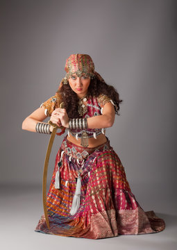 woman in traditional indian costume with saber