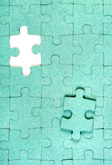 Green puzzle with missing piece