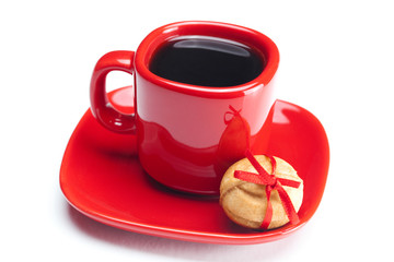 cup with coffee ,cake nut and ribbon isolated on white