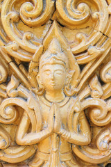 Thai Buddhist art stucco on temple wall background