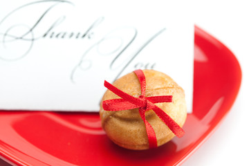 thank you card,cake nut and ribbon isolated on white