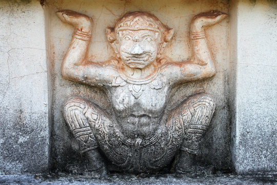 Thai Buddhist art stucco on temple wall background