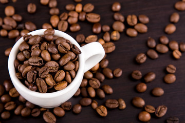 Cup of coffe beans on the table