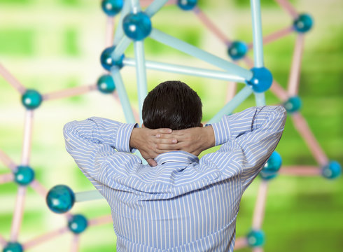 The scientist investigates molecular structure