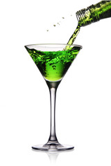 Cocktail splashing into martini glass