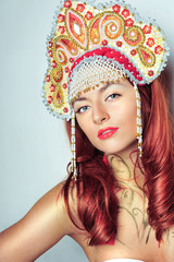 Closeup portrait of pretty young woman with red hairs