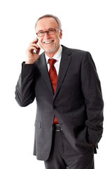 Mature business man with smartphone, isolated