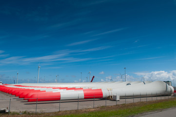 Fototapeta premium row of massive windmill blades in storage