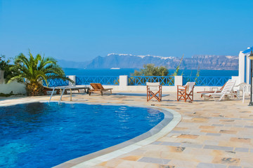 Blue swimming pool in Fira on island of Santorini, Greece. - 32371233