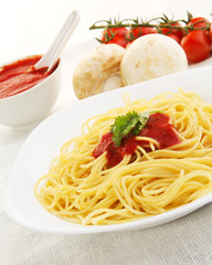 Pasta with tomato sauce basil and grated parsley