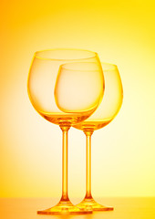 Wine glasses against gradient background