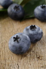 ripe blueberry on wood background