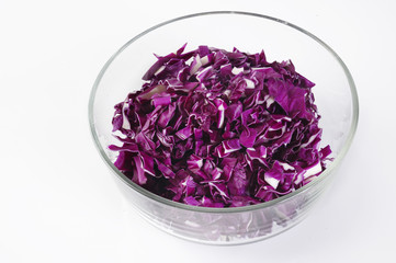 slice purple cabbage on bowl