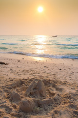 Fototapeta na wymiar Sand castle on the shores of a paradise island
