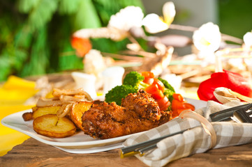 Fried potatoes broccoli carrots and roasted chicken