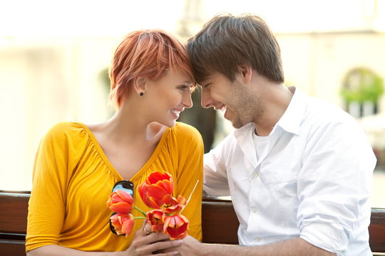 Closeup portrait of a happy young couple looking at each other