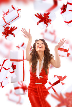 Excited attractive woman with many gift boxes and bags