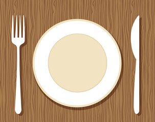 Empty plate with fork and knife on wooden background