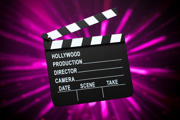 clapperboard on shiny background