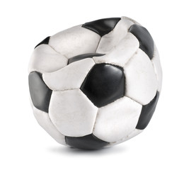 Deflated soccer ball isolated