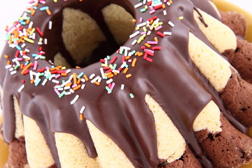 Bundt Cake, covered with chocolate and sprinkles