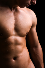 Naklejka premium Beauty men torso. Naked body. Isolated on black.