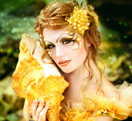 Young beautiful girl in the image of a mermaid
