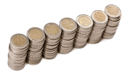 Stacks of 2 Euros Coins in front of white background