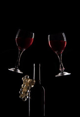 Red wine glasses and bottle